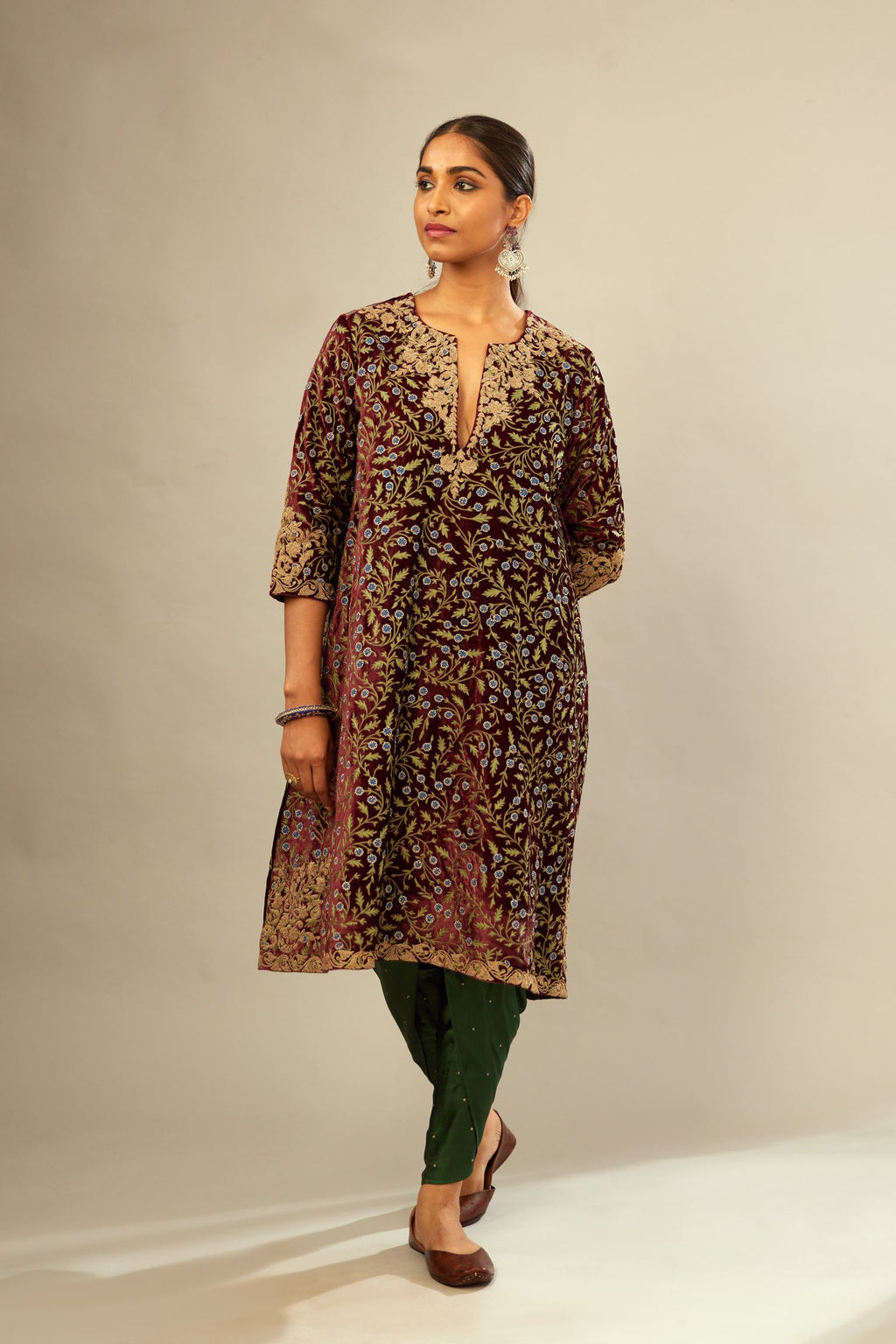 Maroon A-line silk velvet fully jaal embroidered kurta set, detailed with golden dori embroidery