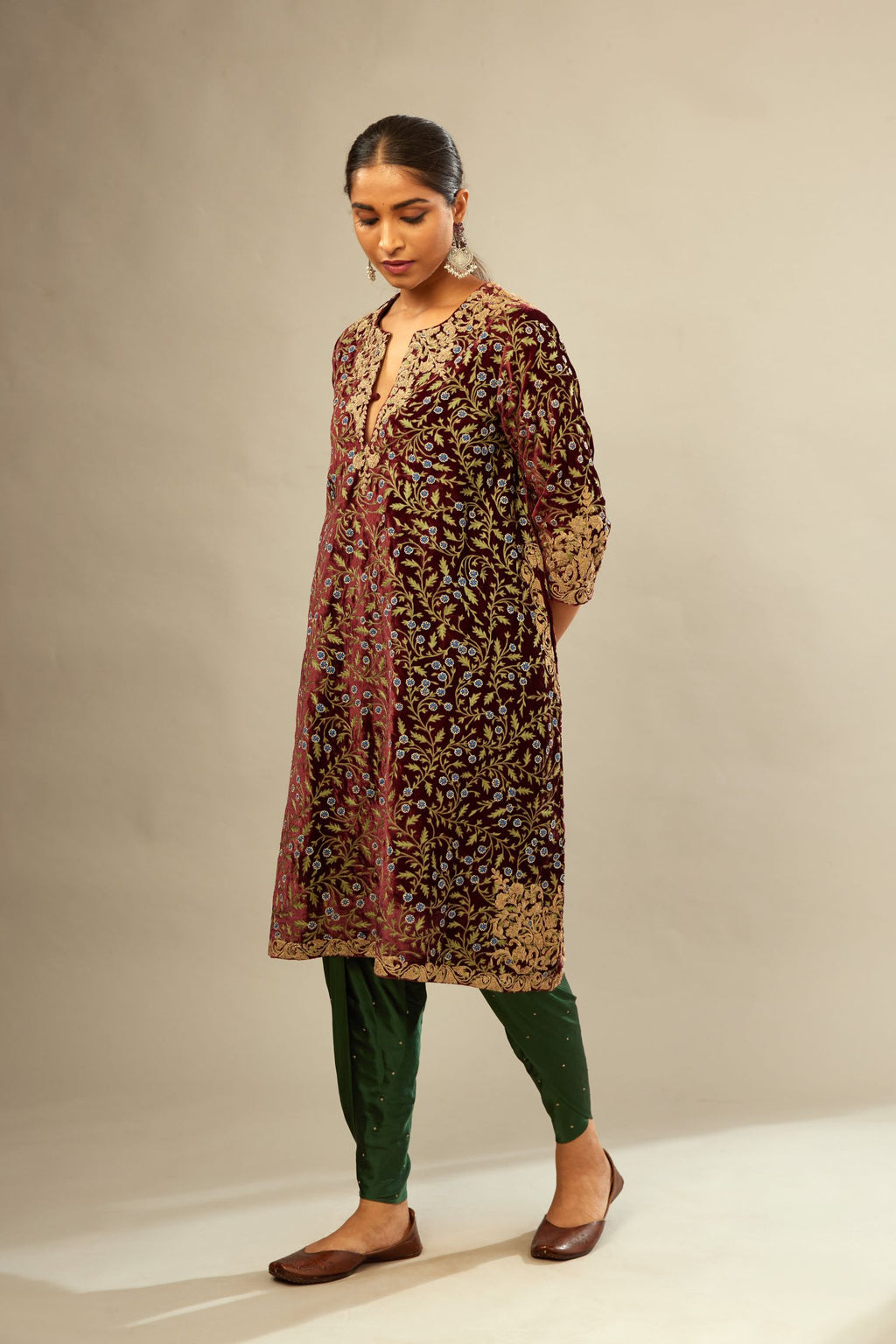 Maroon A-line silk velvet fully jaal embroidered kurta set, detailed with golden dori embroidery