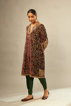 Maroon A-line silk velvet fully jaal embroidered kurta set, detailed with golden dori embroidery