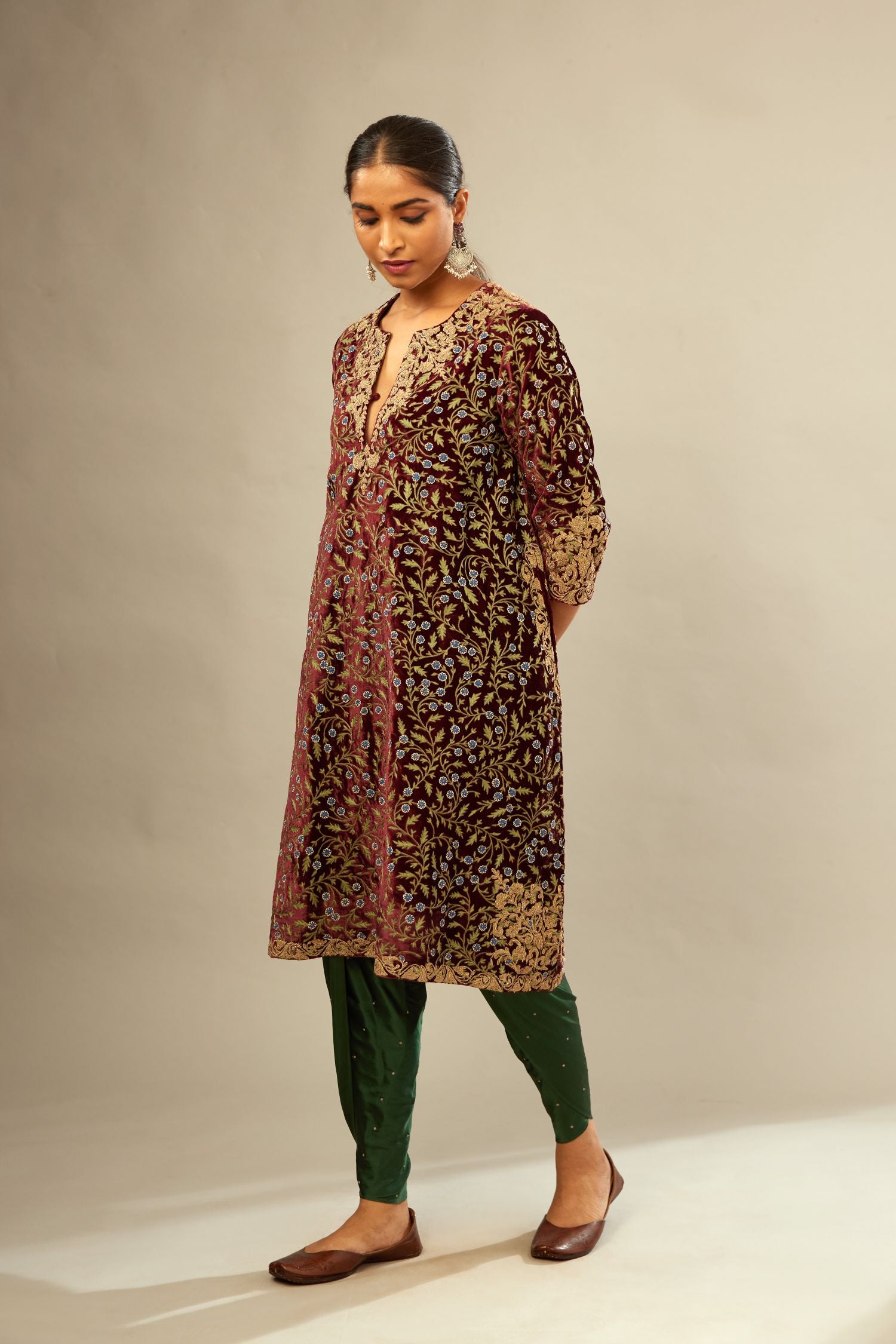 Maroon A-line silk velvet fully jaal embroidered kurta set, detailed with golden dori embroidery