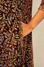 Maroon A-line silk velvet fully jaal embroidered kurta set, detailed with golden dori embroidery