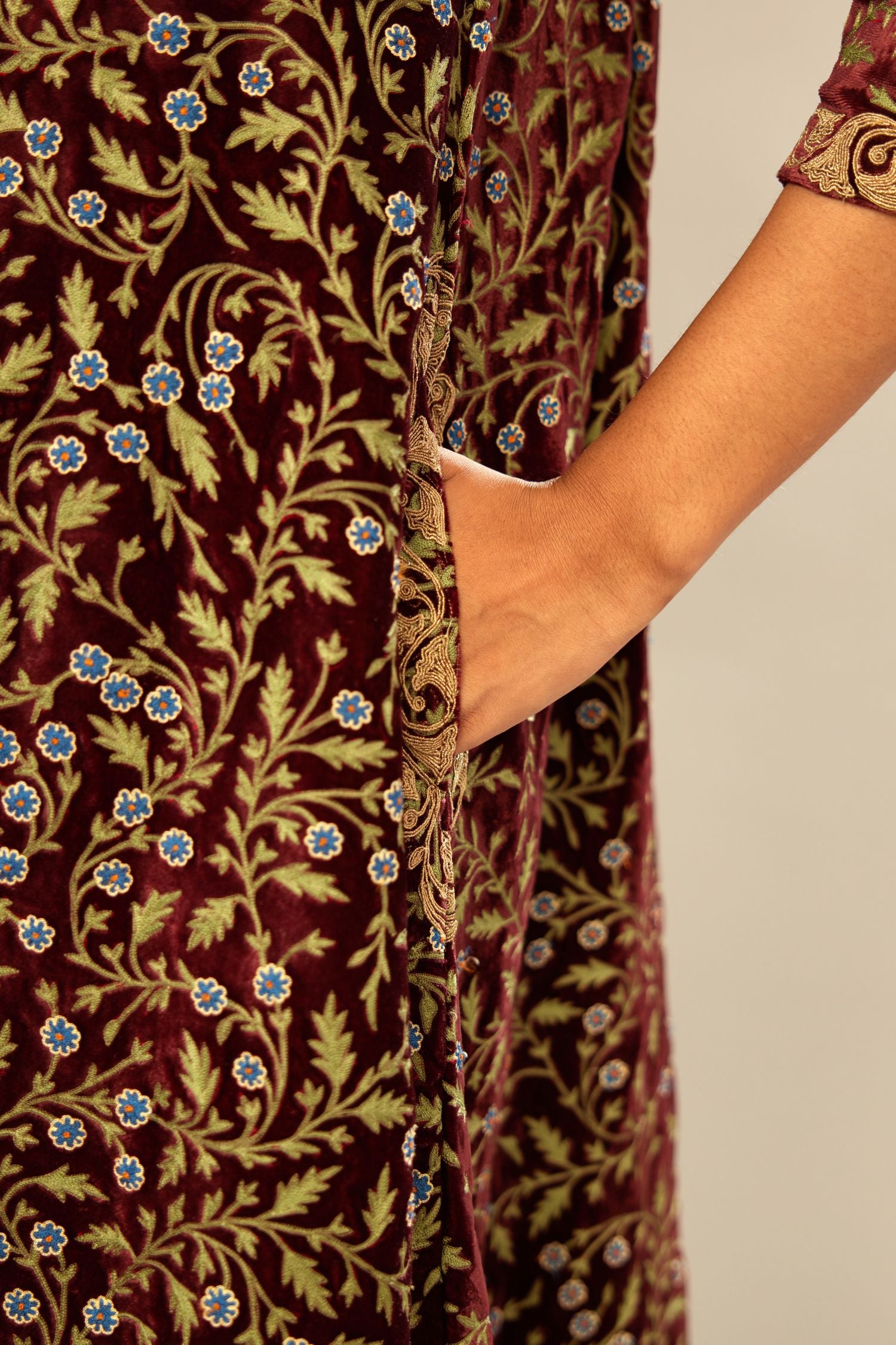 Maroon A-line silk velvet fully jaal embroidered kurta set, detailed with golden dori embroidery