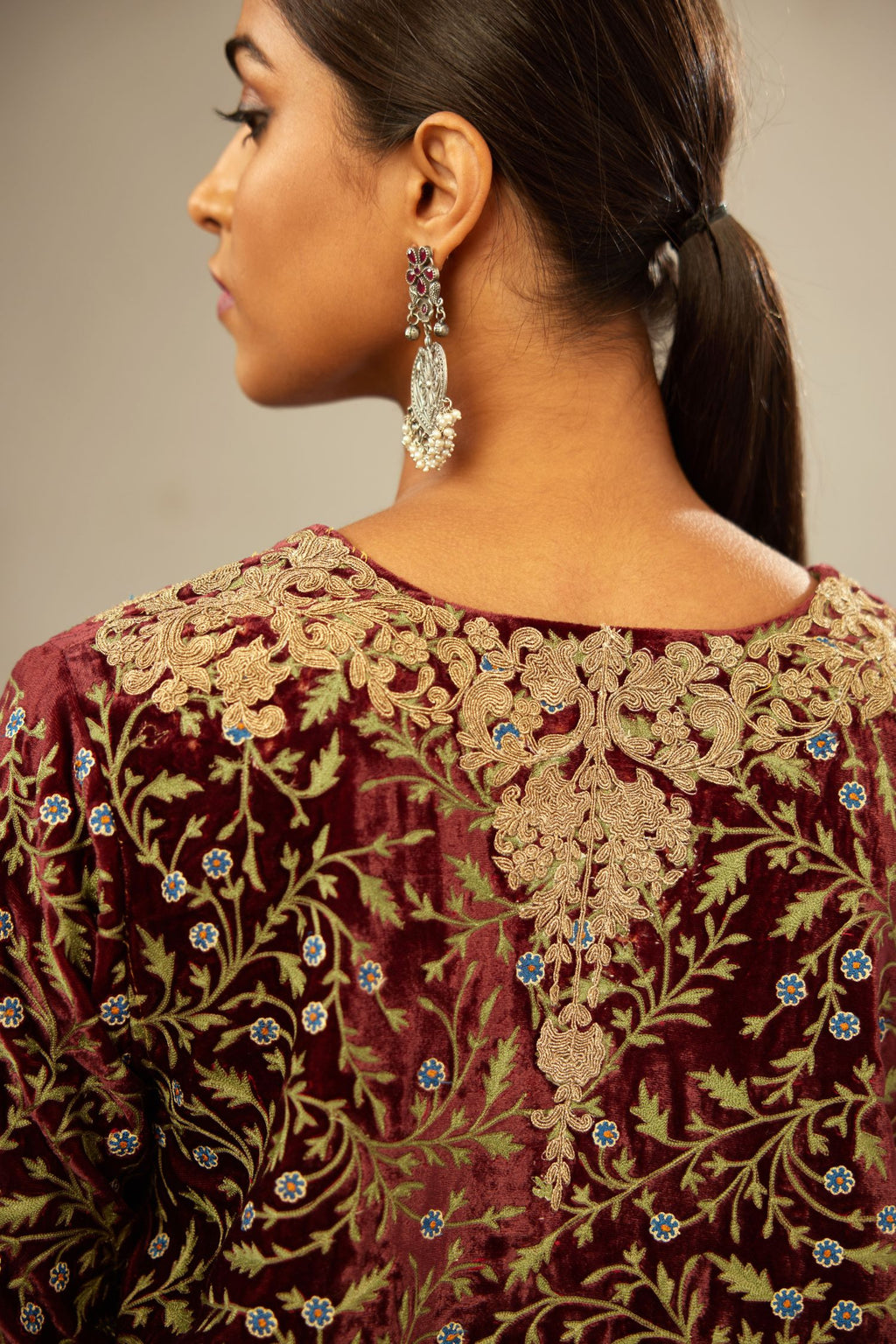 Maroon A-line silk velvet fully jaal embroidered kurta set, detailed with golden dori embroidery
