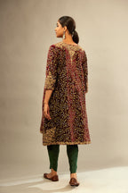 Maroon A-line silk velvet fully jaal embroidered kurta set, detailed with golden dori embroidery