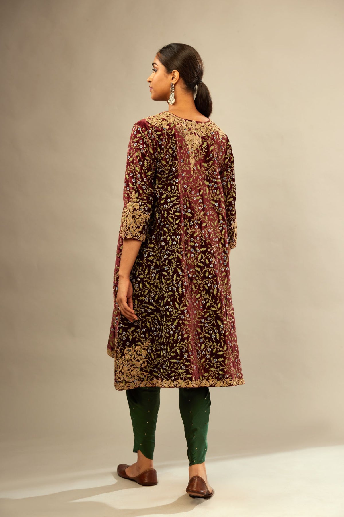 Maroon A-line silk velvet fully jaal embroidered kurta set, detailed with golden dori embroidery