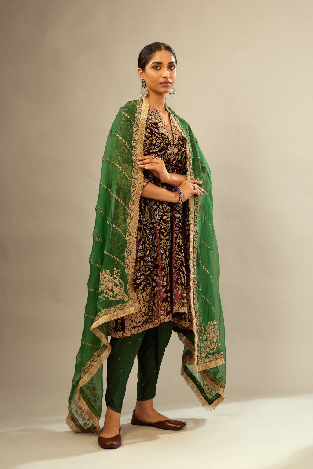 Maroon A-line silk velvet fully jaal embroidered kurta set, detailed with golden dori embroidery
