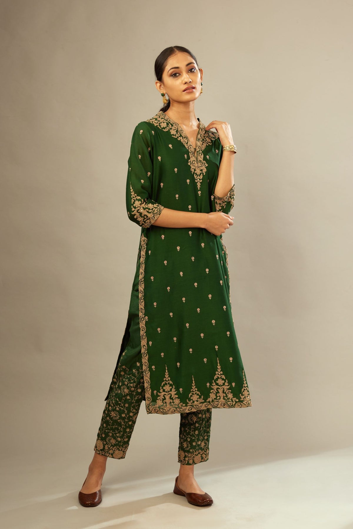 Green silk chanderi straight kurta set with gold dori embroidery, detailed with small aari embroidery buties all-over.