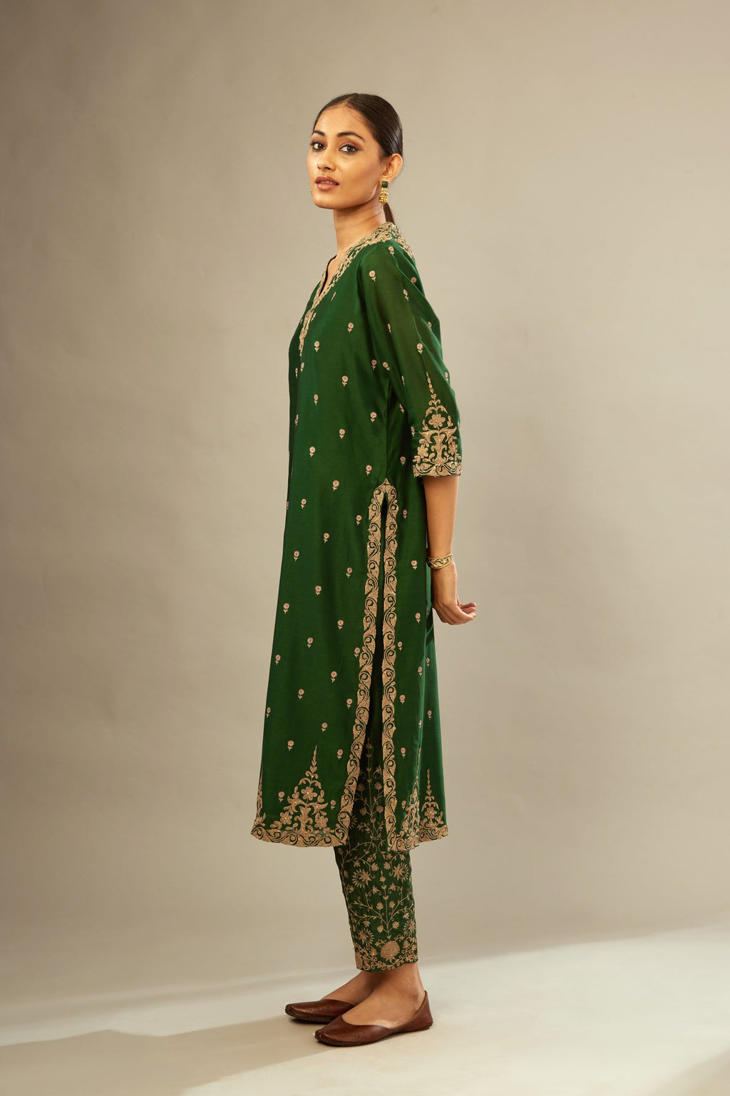 Green silk chanderi straight kurta set with gold dori embroidery, detailed with small aari embroidery buties all-over.