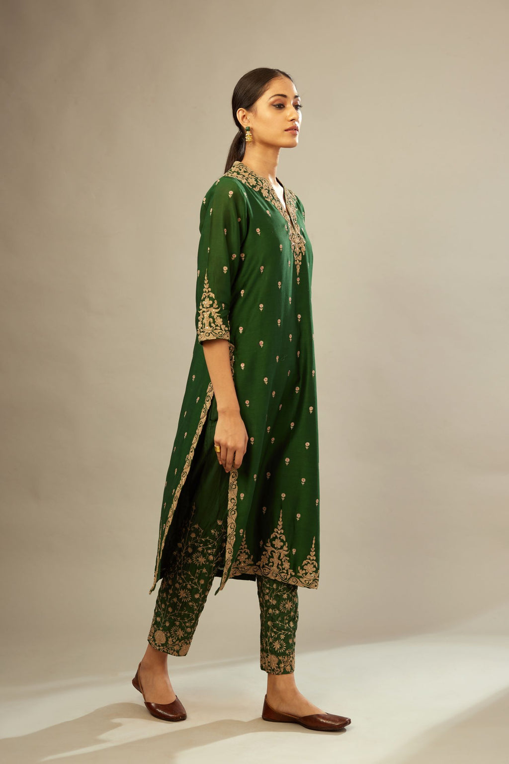 Green silk chanderi straight kurta set with gold dori embroidery, detailed with small aari embroidery buties all-over.