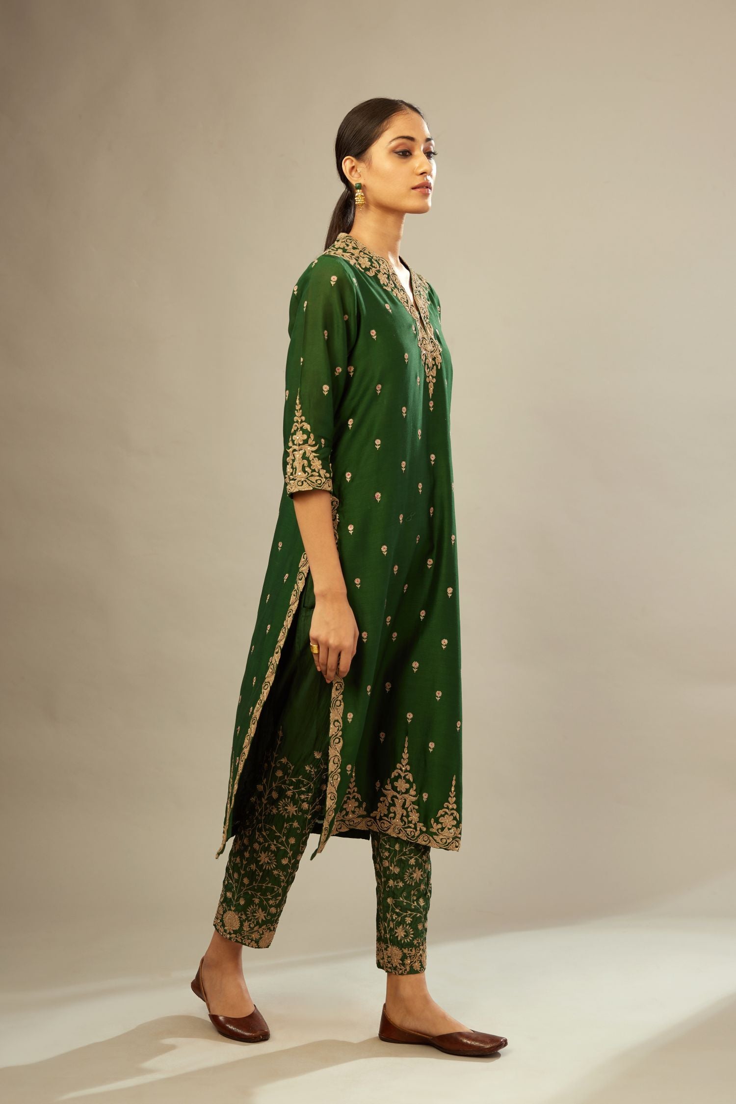 Green silk chanderi straight kurta set with gold dori embroidery, detailed with small aari embroidery buties all-over.