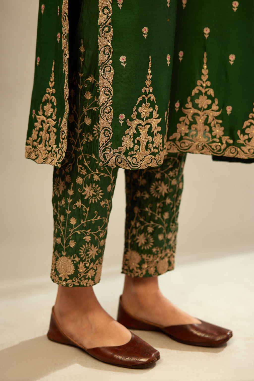 Green silk chanderi straight kurta set with gold dori embroidery, detailed with small aari embroidery buties all-over.