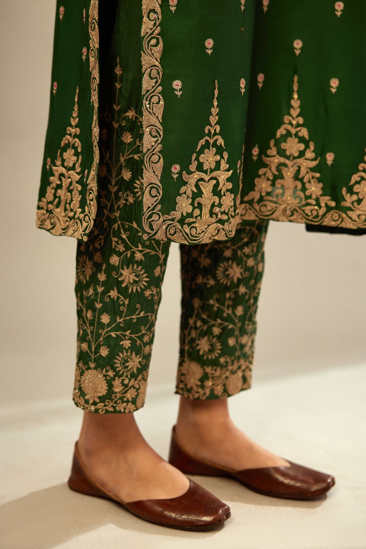 Green silk chanderi straight kurta set with gold dori embroidery, detailed with small aari embroidery buties all-over.