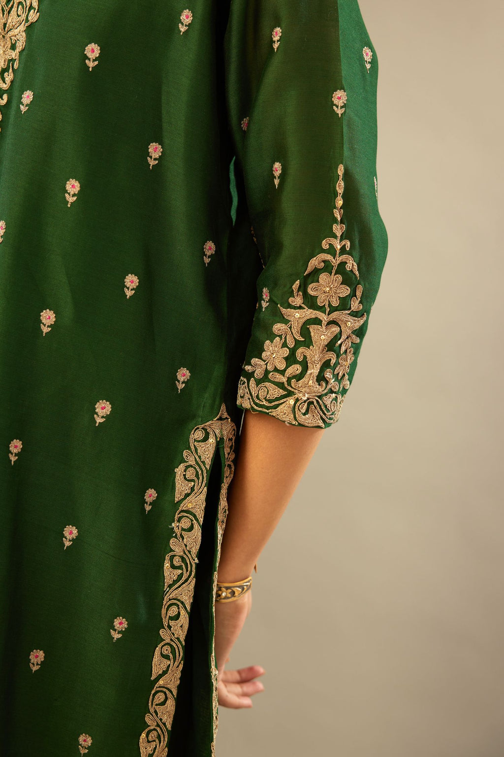 Green silk chanderi straight kurta set with gold dori embroidery, detailed with small aari embroidery buties all-over.