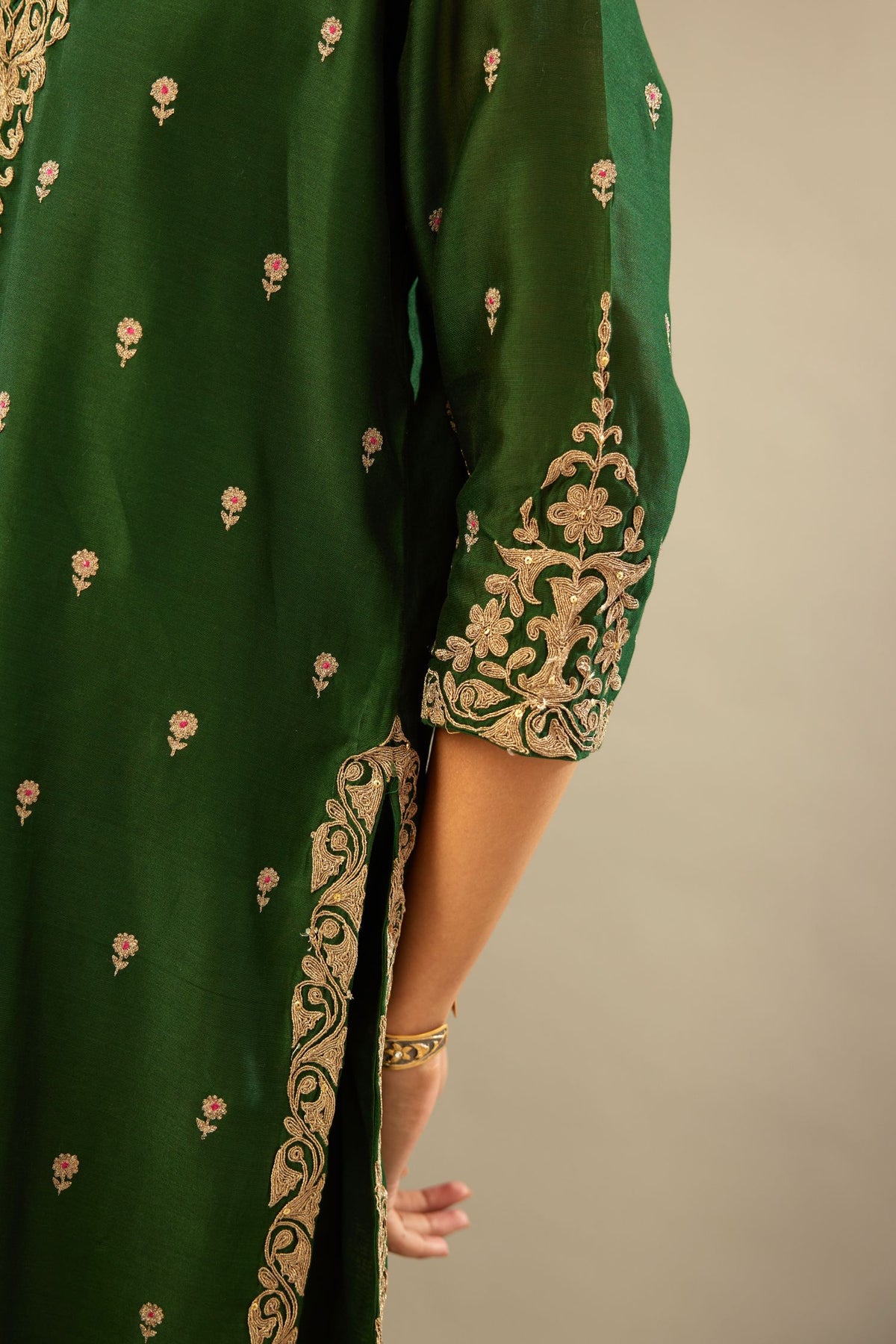 Green silk chanderi straight kurta set with gold dori embroidery, detailed with small aari embroidery buties all-over.