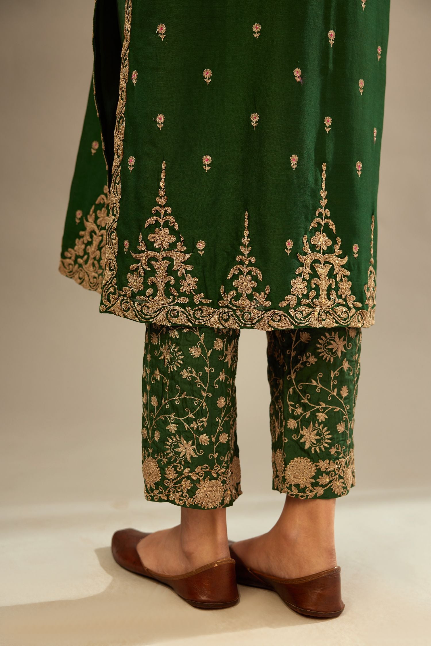 Green silk chanderi straight kurta set with gold dori embroidery, detailed with small aari embroidery buties all-over.