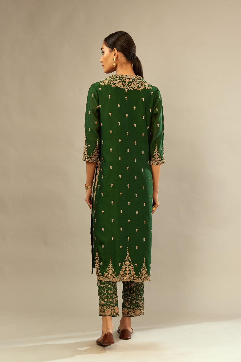 Green silk chanderi straight kurta set with gold dori embroidery, detailed with small aari embroidery buties all-over.