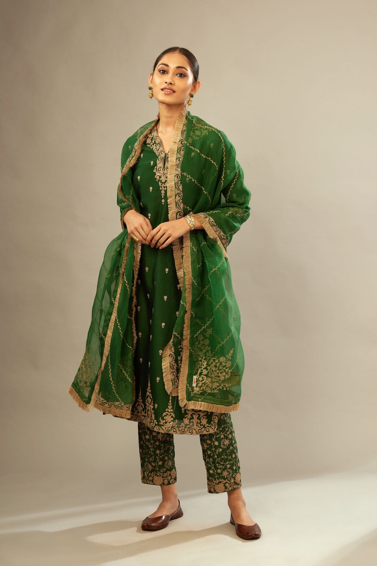 Green silk chanderi straight kurta set with gold dori embroidery, detailed with small aari embroidery buties all-over.