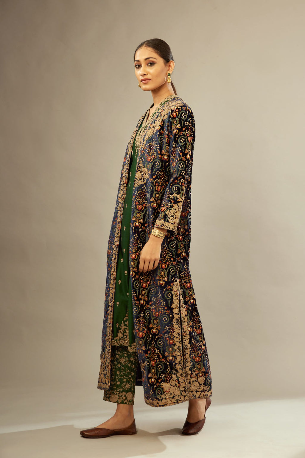 Navy blue silk velvet ankle length front open jacket with fully silk thread jaal embroidery and detailed with light gold dori embroidery.