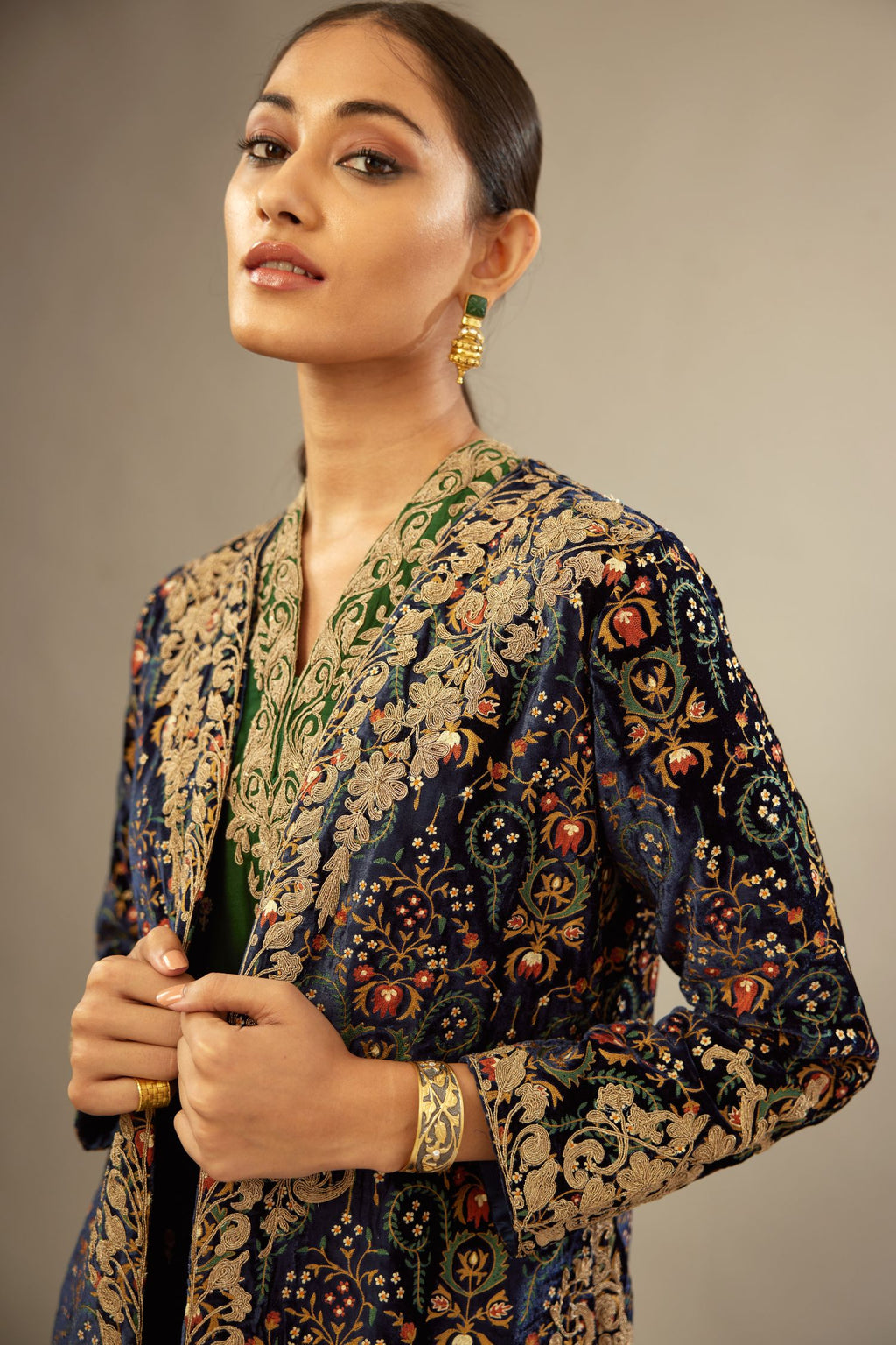 Navy blue silk velvet ankle length front open jacket with fully silk thread jaal embroidery and detailed with light gold dori embroidery.
