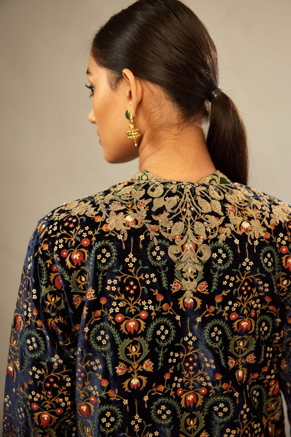 Navy blue silk velvet ankle length front open jacket with fully silk thread jaal embroidery and detailed with light gold dori embroidery.