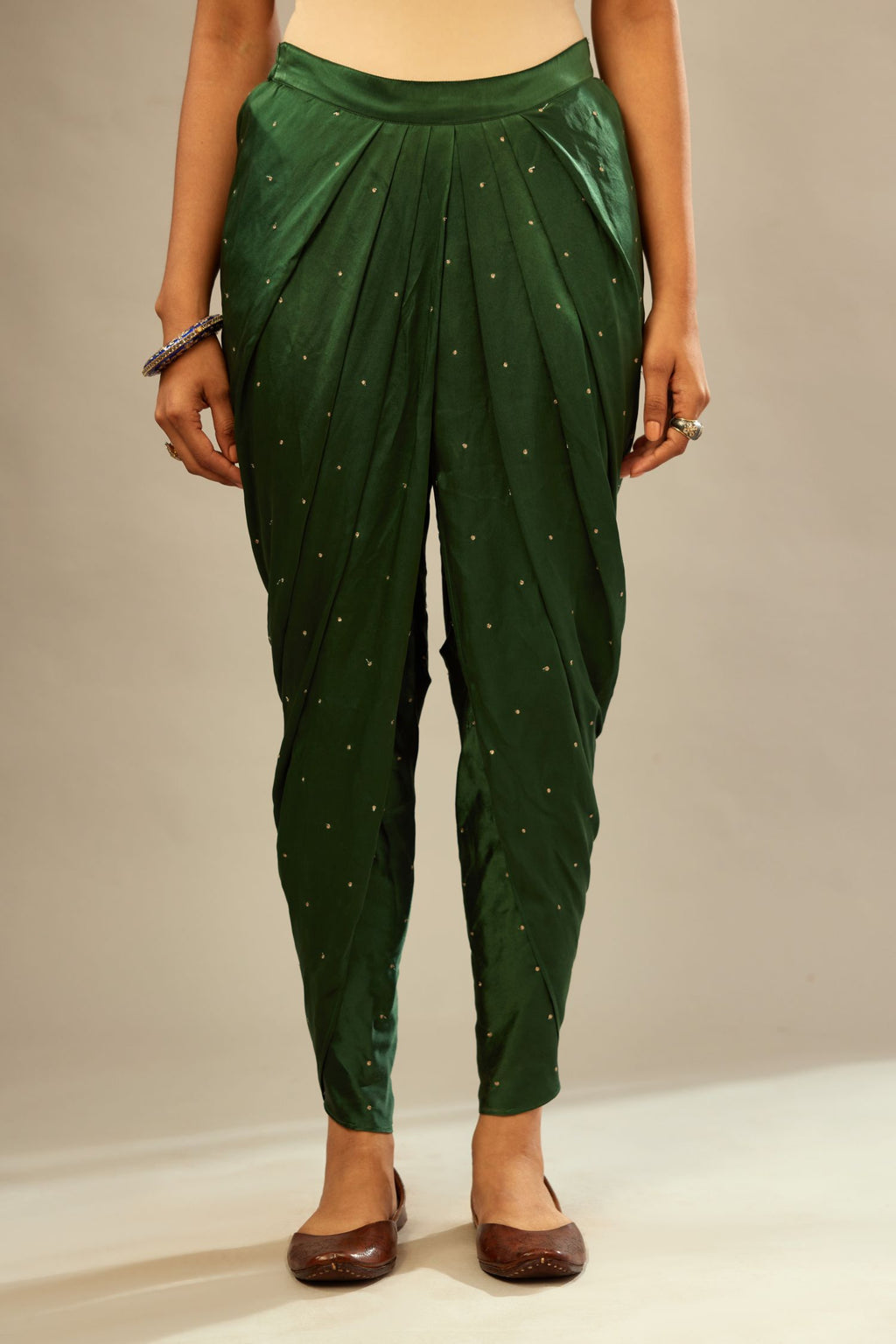 Green silk dhoti with all over small flower embroidery.