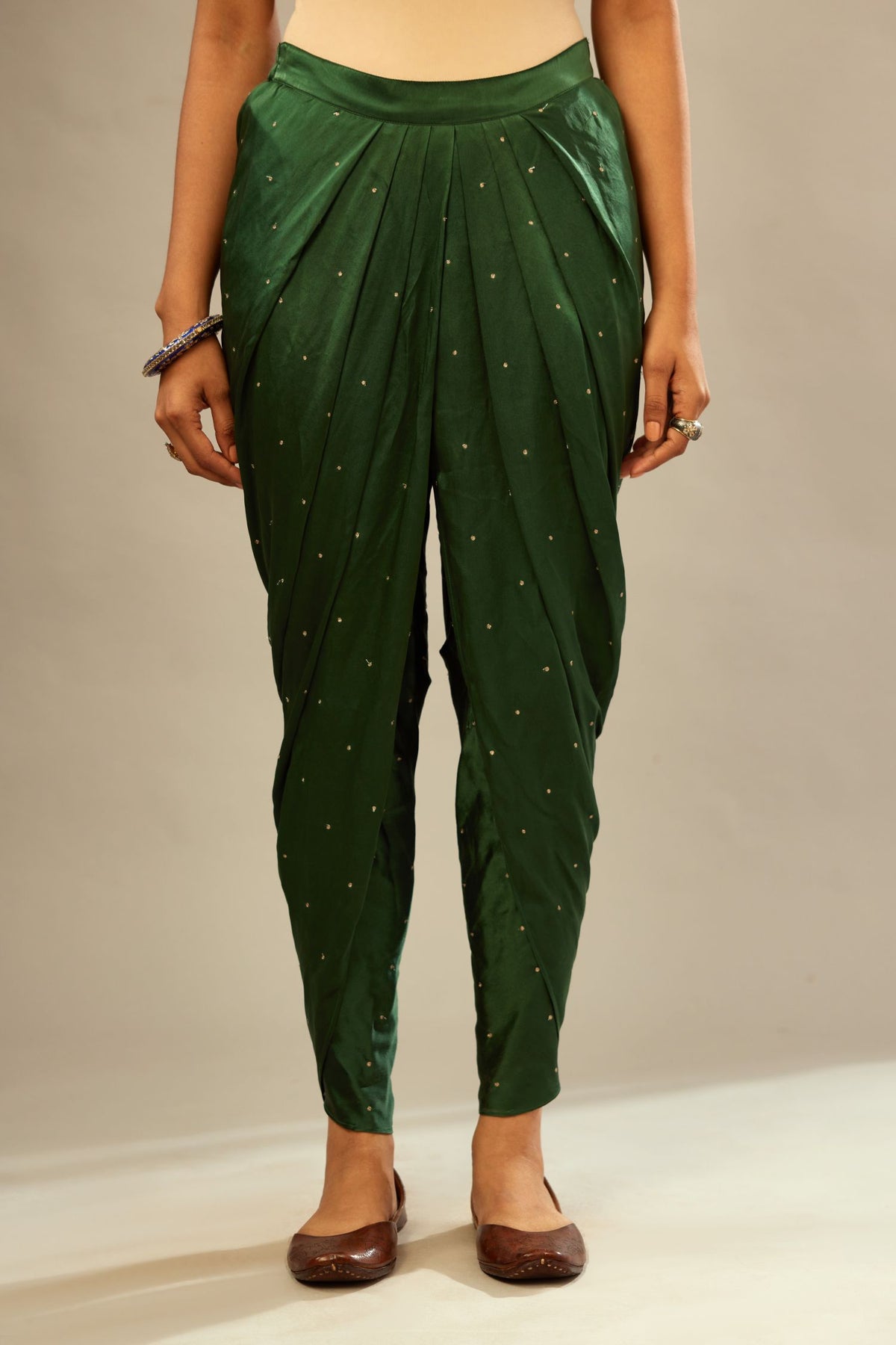 Green silk dhoti with all over small flower embroidery.