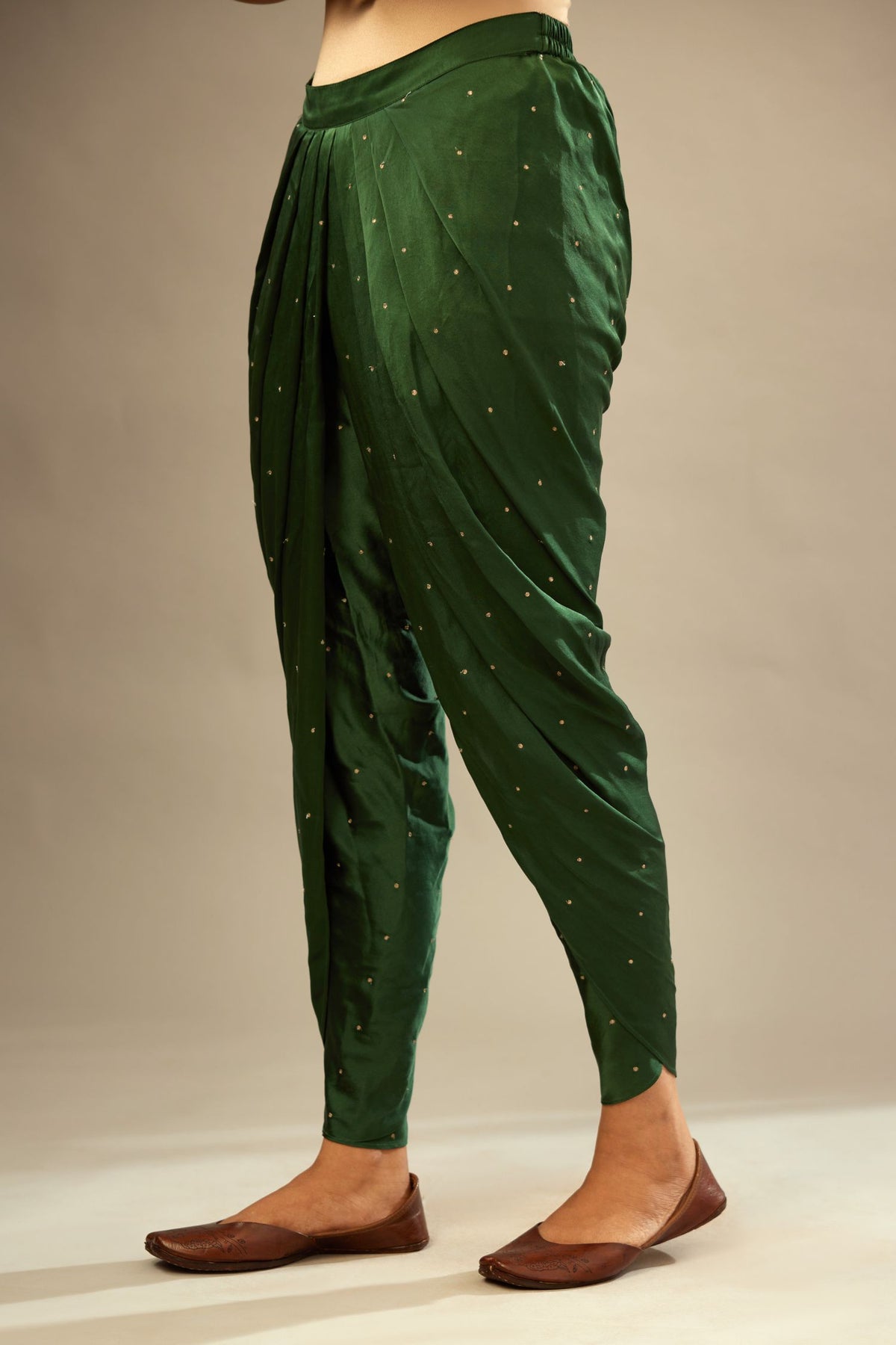 Green silk dhoti with all over small flower embroidery.
