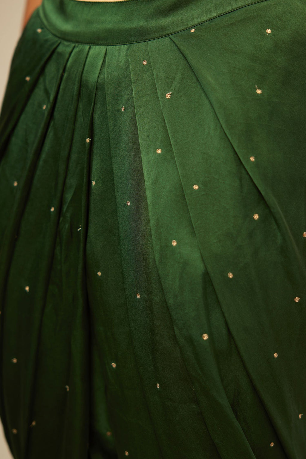 Green silk dhoti with all over small flower embroidery.