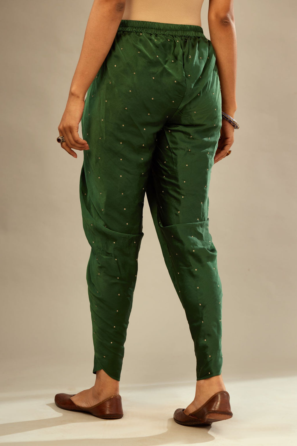Green silk dhoti with all over small flower embroidery.