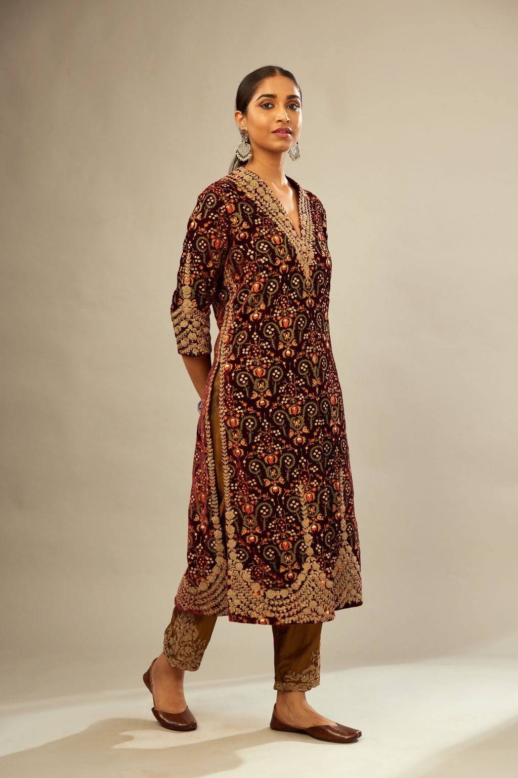 Maroon silk velvet lined kurta set with heavy jaal embroidery all over the kurta and ornamented with dori embroidery at neck, sleeves, side slits and hem.