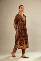 Maroon silk velvet lined kurta set with heavy jaal embroidery all over the kurta and ornamented with dori embroidery at neck, sleeves, side slits and hem.