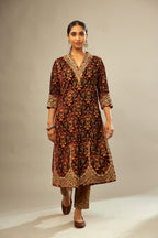 Maroon silk velvet lined kurta set with heavy jaal embroidery all over the kurta and ornamented with dori embroidery at neck, sleeves, side slits and hem.