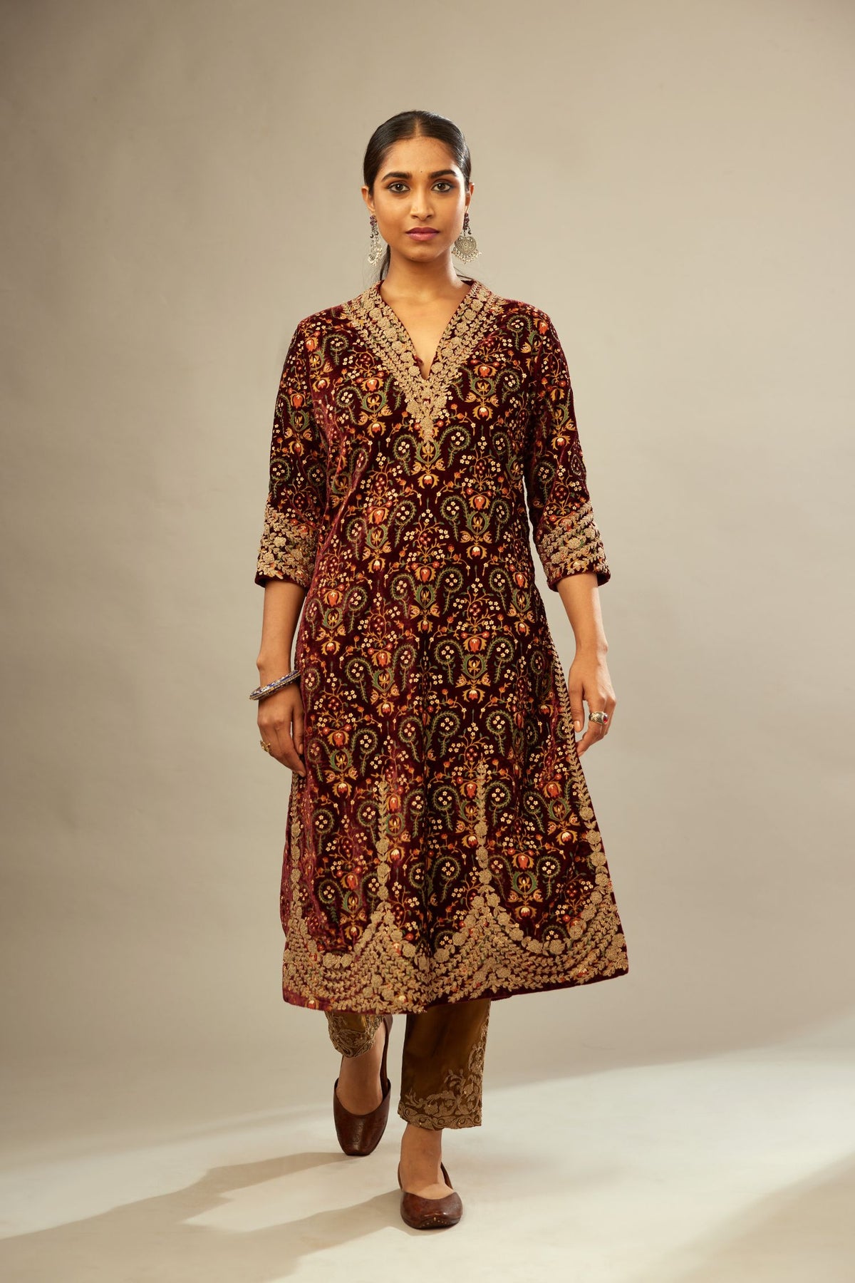 Maroon silk velvet lined kurta set with heavy jaal embroidery all over the kurta and ornamented with dori embroidery at neck, sleeves, side slits and hem.