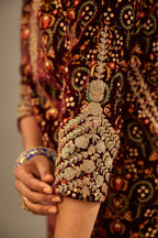 Maroon silk velvet lined kurta set with heavy jaal embroidery all over the kurta and ornamented with dori embroidery at neck, sleeves, side slits and hem.