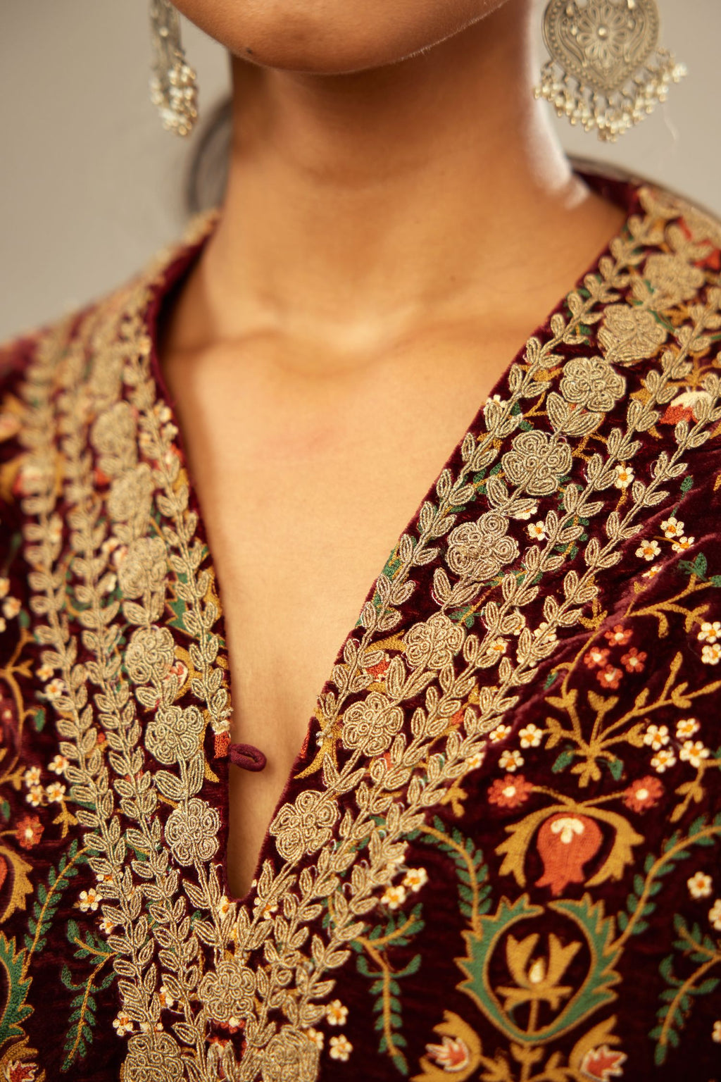 Maroon silk velvet lined kurta set with heavy jaal embroidery all over the kurta and ornamented with dori embroidery at neck, sleeves, side slits and hem.