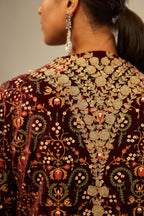 Maroon silk velvet lined kurta set with heavy jaal embroidery all over the kurta and ornamented with dori embroidery at neck, sleeves, side slits and hem.