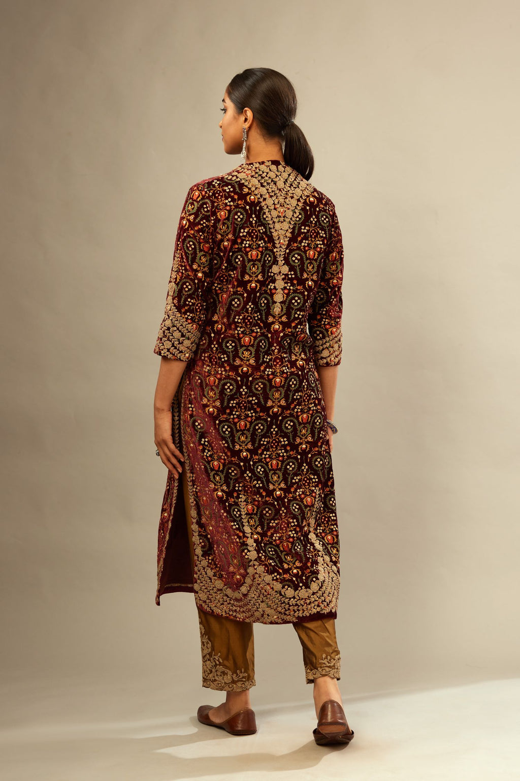 Maroon silk velvet lined kurta set with heavy jaal embroidery all over the kurta and ornamented with dori embroidery at neck, sleeves, side slits and hem.