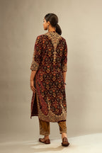 Maroon silk velvet lined kurta set with heavy jaal embroidery all over the kurta and ornamented with dori embroidery at neck, sleeves, side slits and hem.