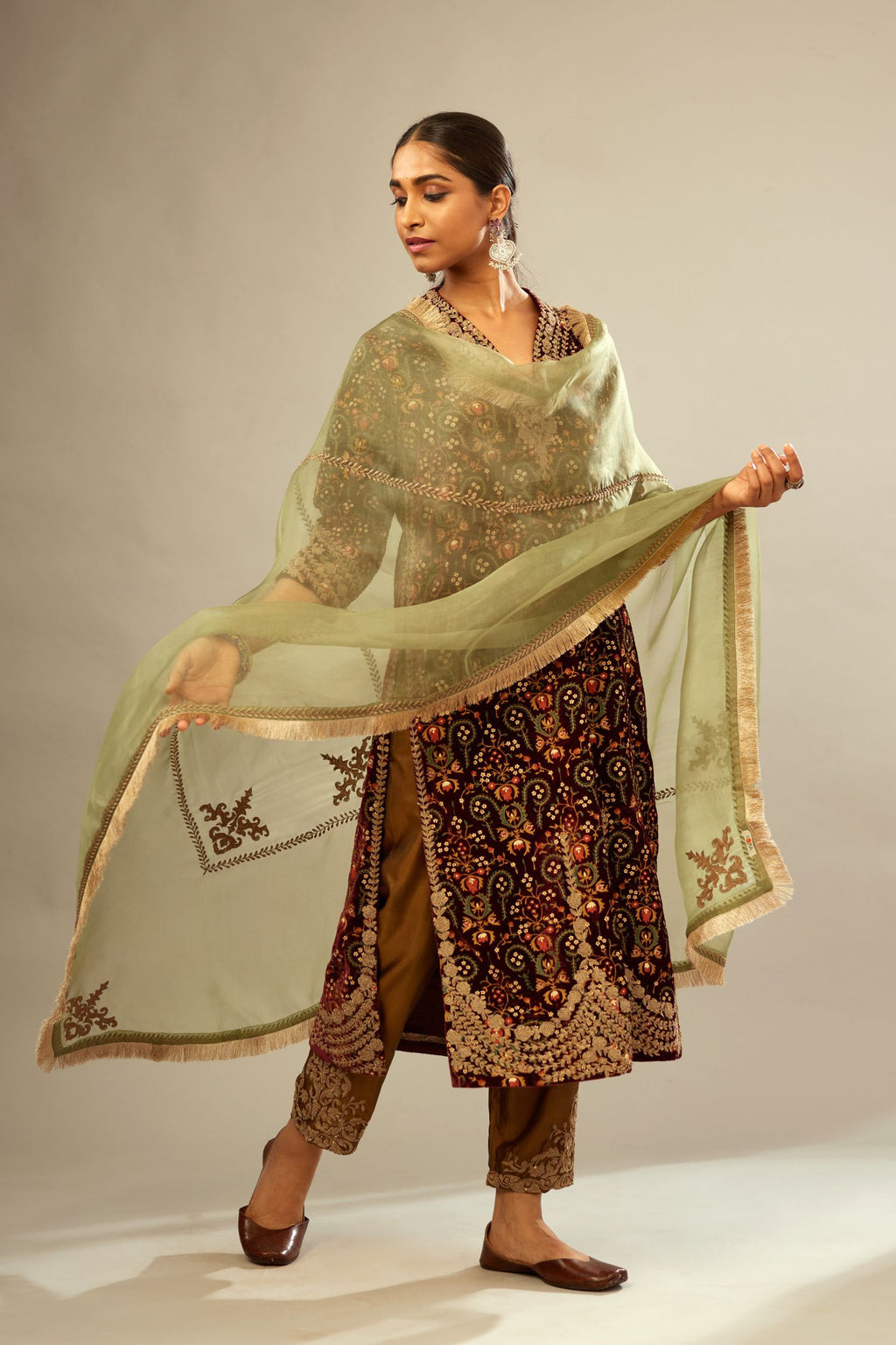 Maroon silk velvet lined kurta set with heavy jaal embroidery all over the kurta and ornamented with dori embroidery at neck, sleeves, side slits and hem.
