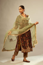 Maroon silk velvet lined kurta set with heavy jaal embroidery all over the kurta and ornamented with dori embroidery at neck, sleeves, side slits and hem.