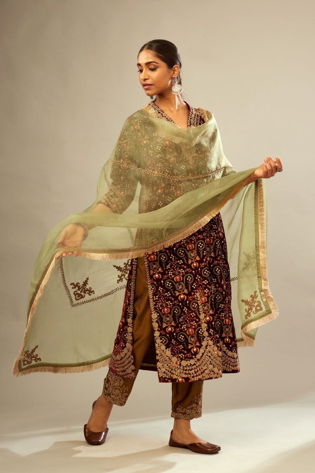 Maroon silk velvet lined kurta set with heavy jaal embroidery all over the kurta and ornamented with dori embroidery at neck, sleeves, side slits and hem.