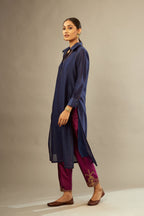 Green long silk chanderi front open sleeveless jacket set with gold dori embroidery detailing, highlighted with gold sequin work.