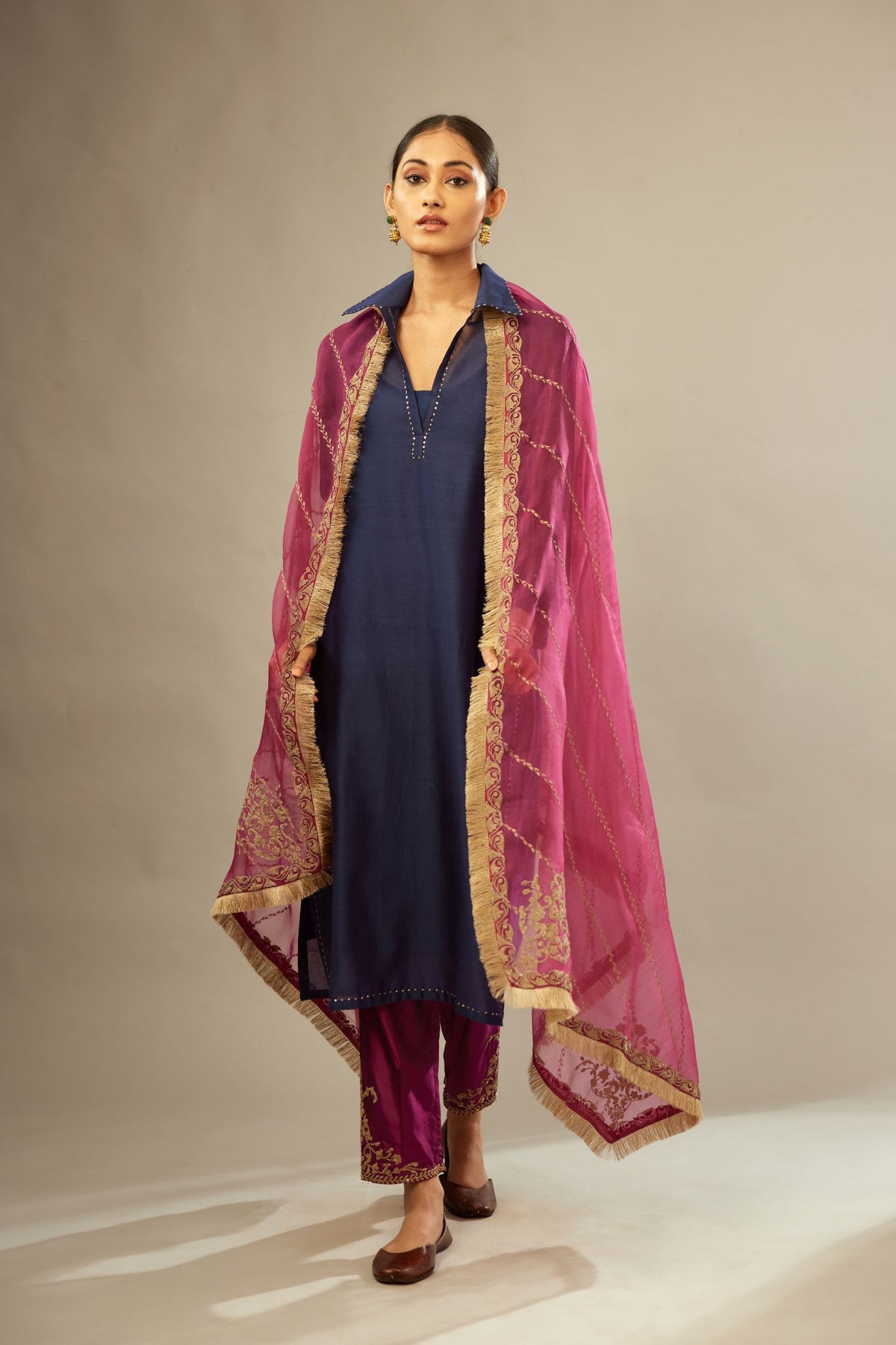Navy blue silk chanderi kurta set with a shirt collar neckline and full sleeves, detailed with gold sequin work.