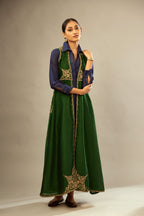 Green long silk chanderi front open sleeveless jacket set with gold dori embroidery detailing, highlighted with gold sequin work.