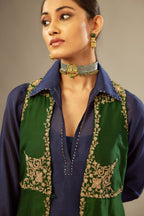 Green long silk chanderi front open sleeveless jacket set with gold dori embroidery detailing, highlighted with gold sequin work.