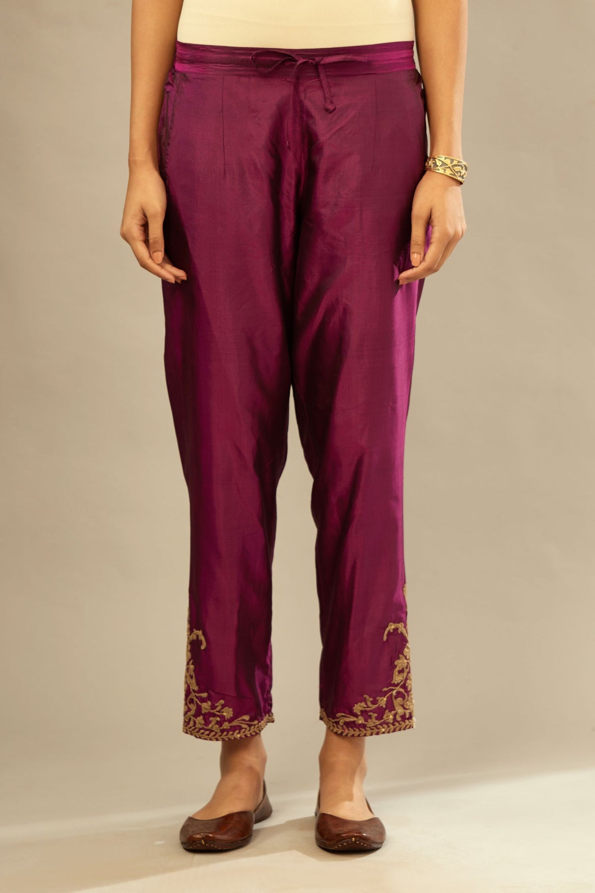 Sangria silk straight pants with dori embroidered bootas at hem.