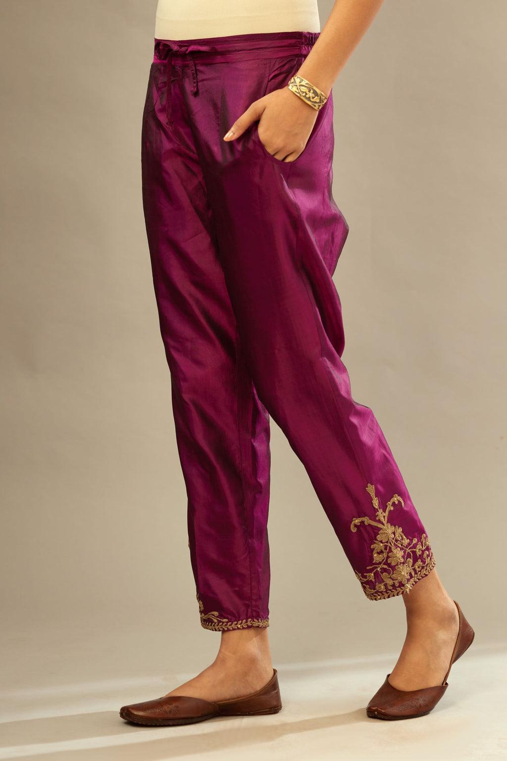 Sangria silk straight pants with dori embroidered bootas at hem.