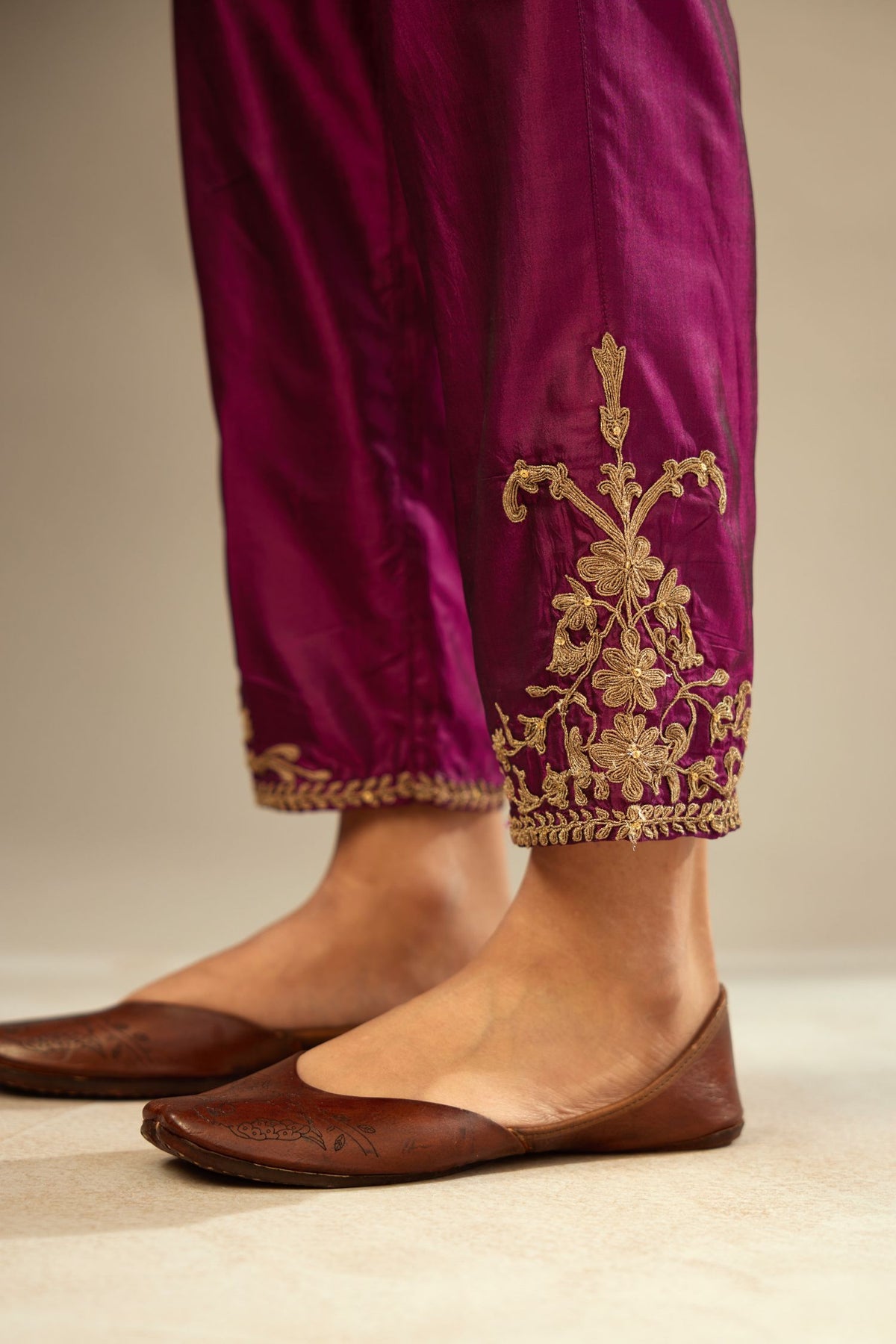 Sangria silk straight pants with dori embroidered bootas at hem.