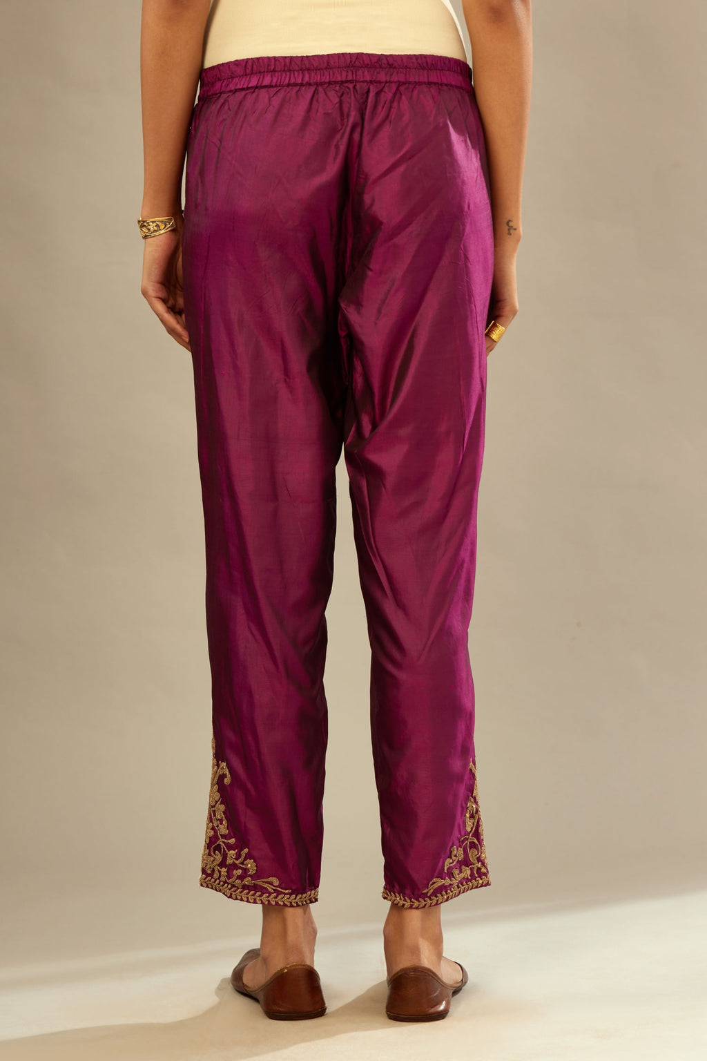 Sangria silk straight pants with dori embroidered bootas at hem.