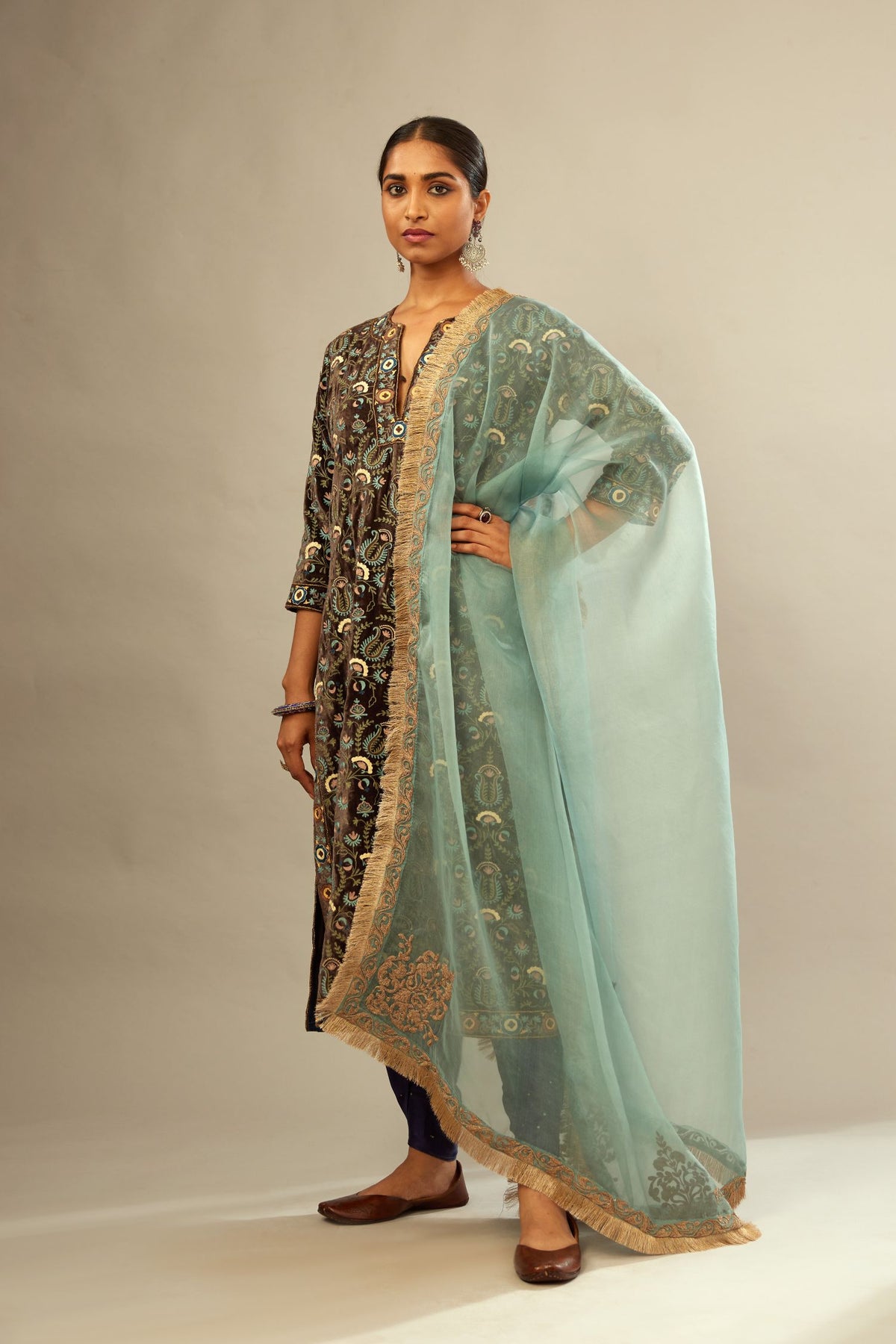 Light blue silk organza dupatta with light gold dori embroidered border and bootas at all four corners.